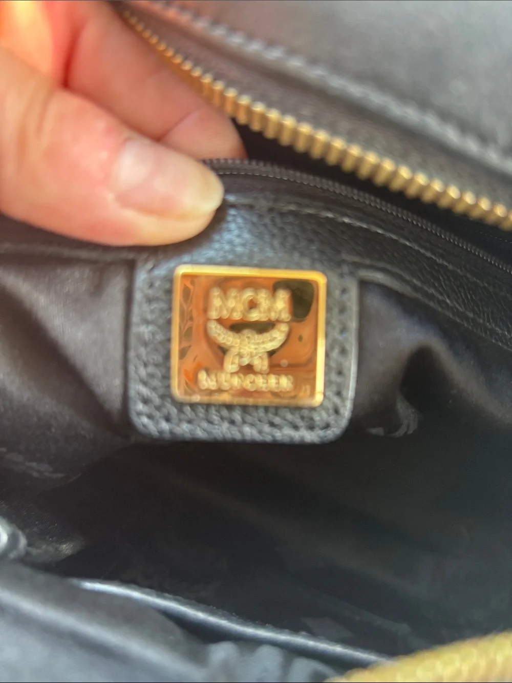 MCM Black Leather Satchel with Gold Hardware Accents